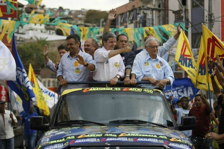 a crowd of people sitting in the bed of a truck