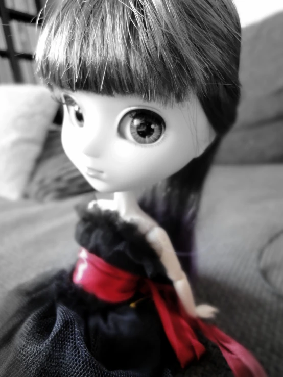 a very cute doll with a black shirt