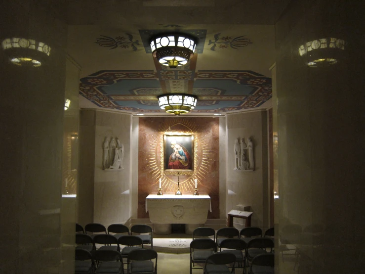 an empty church has chairs lined up in the hallway