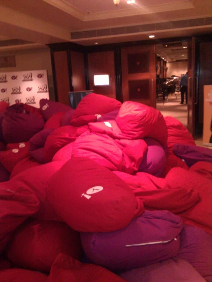 there are many bean bags stacked up together