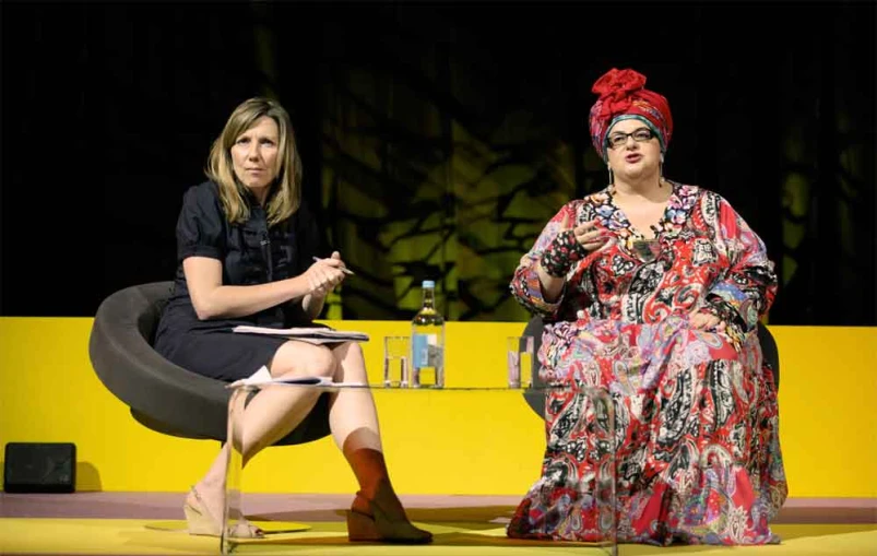 two women on stage having an discussion