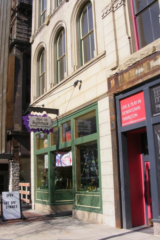 the sign for a salon and jewelry store is attached to a building