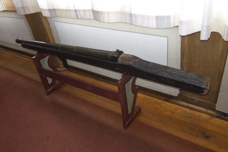 the old wooden rifle is on display in the museum