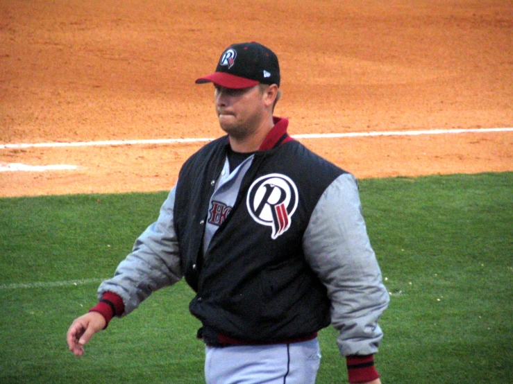 baseball player standing on the field ready to bat