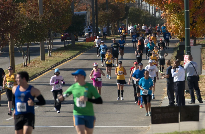 a group of runners run together in the race