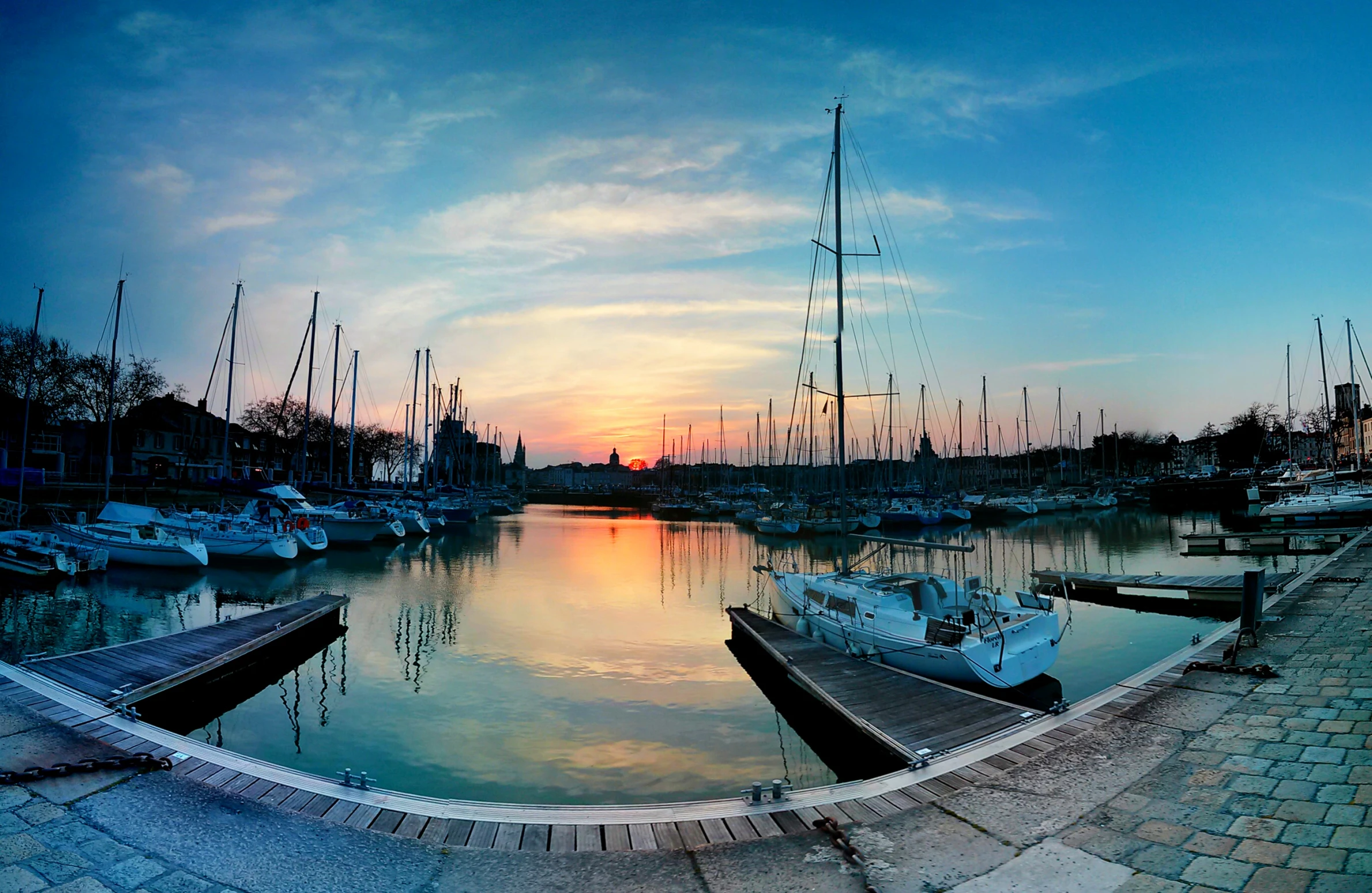 boats in the water are at the docks