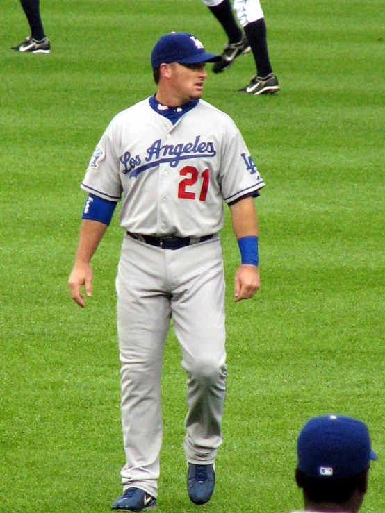 a man in uniform is running on a field