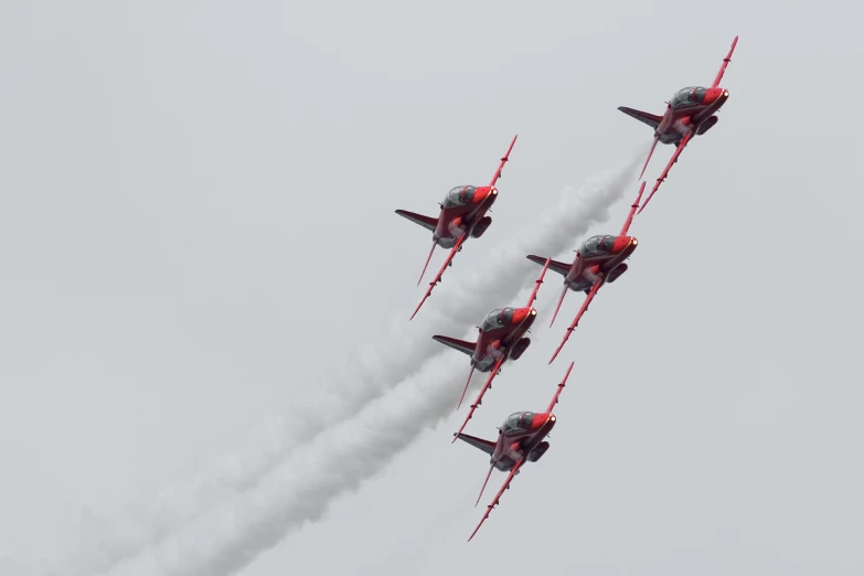 four planes flying in formation in the air