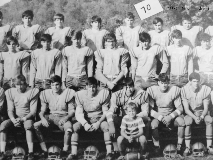 a team po of a football team posing for the camera