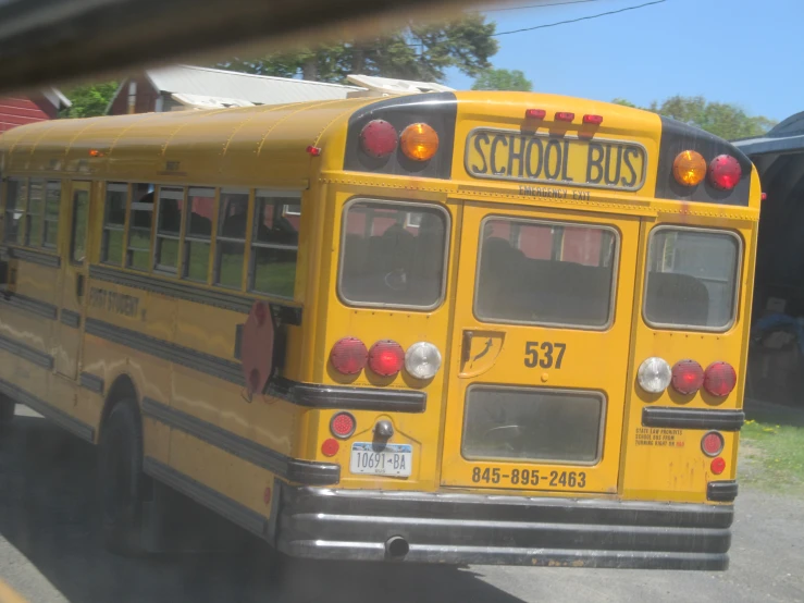 a school bus is parked in front of the house