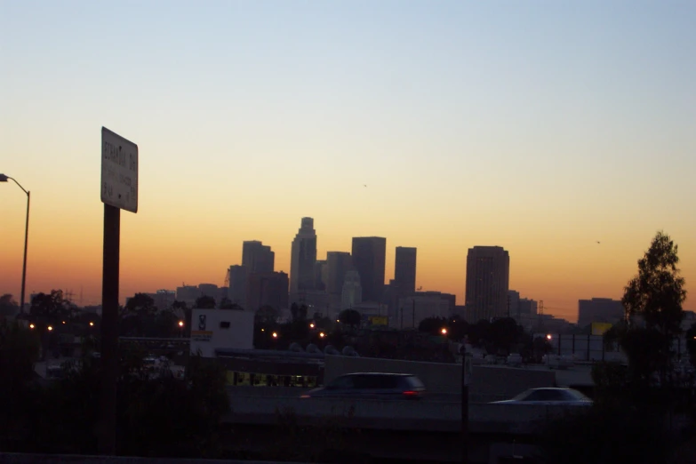 a skyline is lit up with city lights