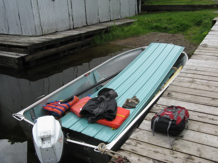 a boat has some life vests on the front and side