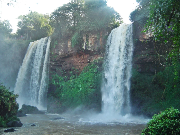 a large waterfall with water coming out the side