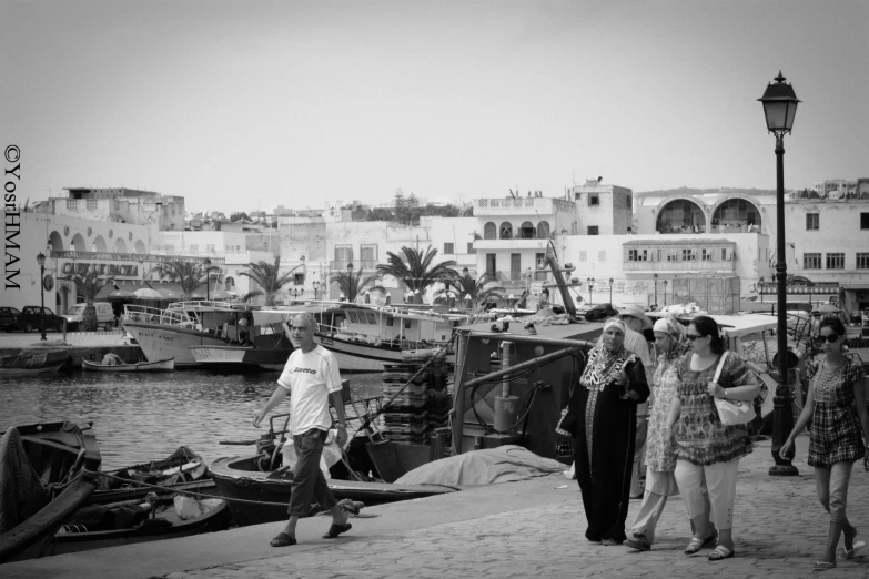 people walk along the river on a boat