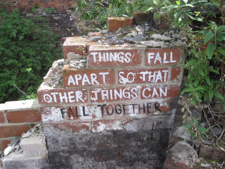 a wall with brick writing on it that says things fall apart so that other things can flip together