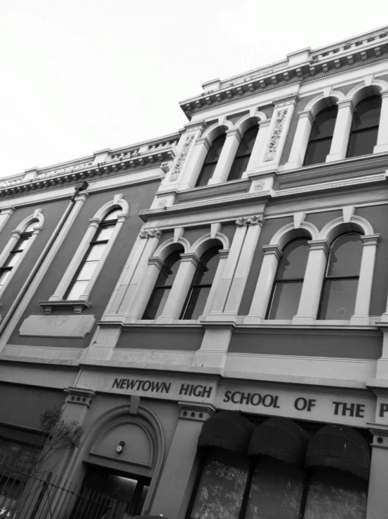 the front of newton high school with a tall tower