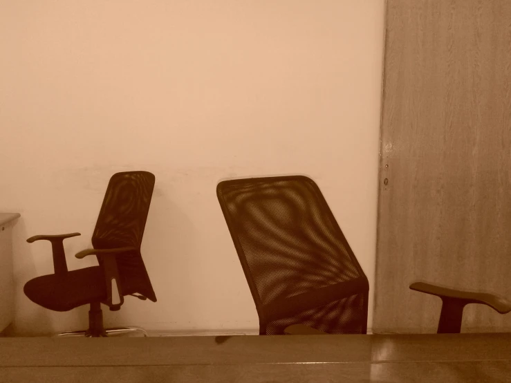 two office chairs in a waiting area at an office