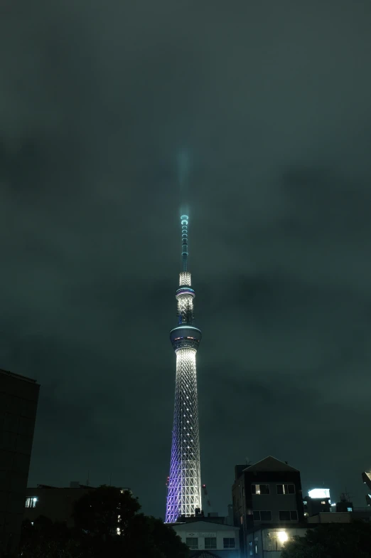 there is a tower with lights on at night