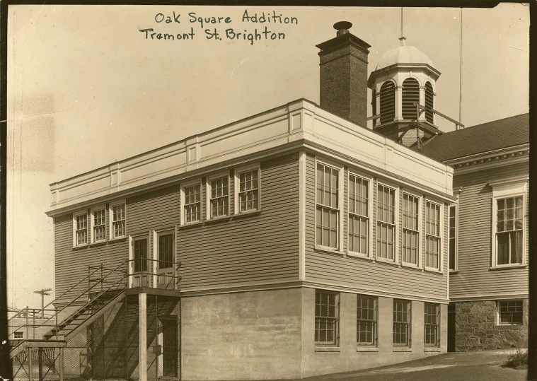 a sepia pograph of a building with a steeple