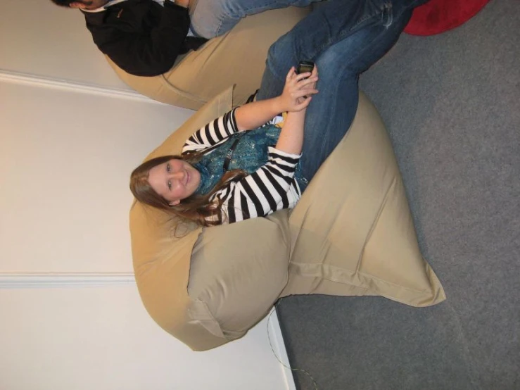 a woman sitting on a large bean bag chair