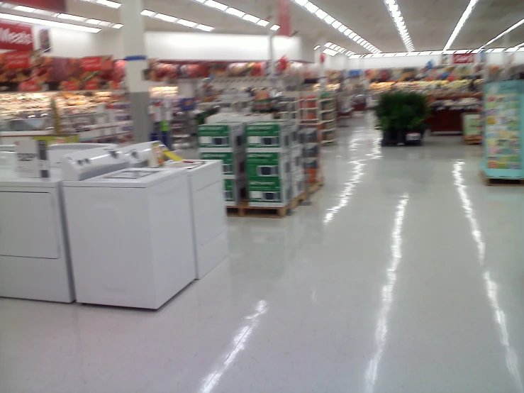 a washer and dryer stacked in the middle of a warehouse