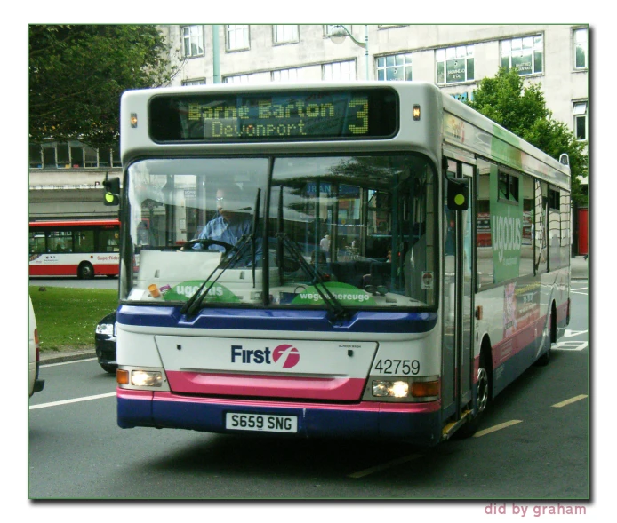 a bus is travelling down the street