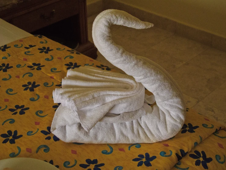 a towel folded on the floor in a very elaborate way