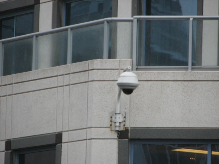 a security camera is outside of an office building