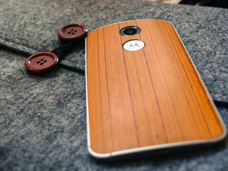 a close up of a wooden case on a cellphone