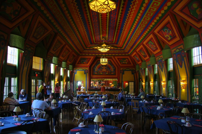 the dining room is covered in blue and yellow