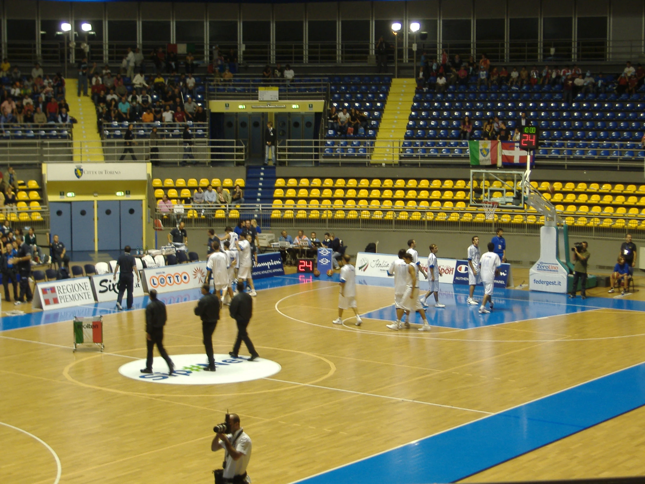 people in the middle of an indoor basketball court