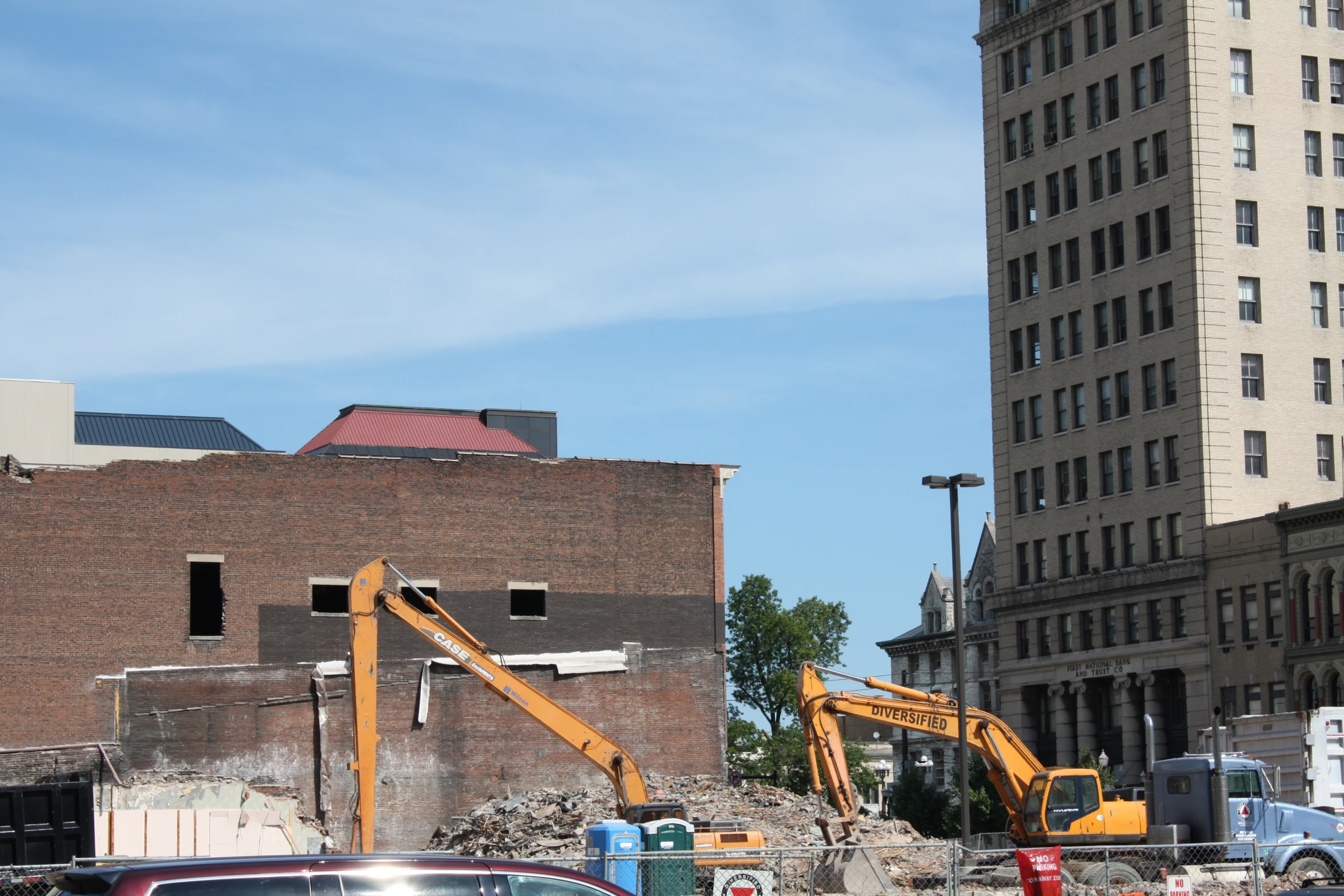 a construction site with an excavator and machinery nearby