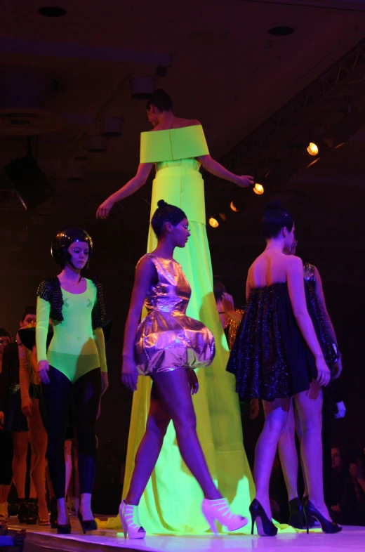 fashion shows a neon color scheme in this dark po