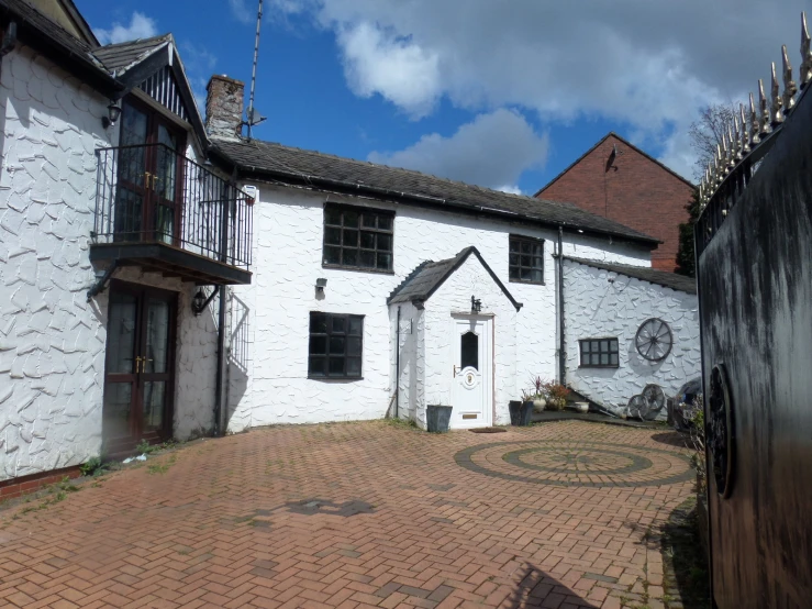 two large buildings with small patios outside