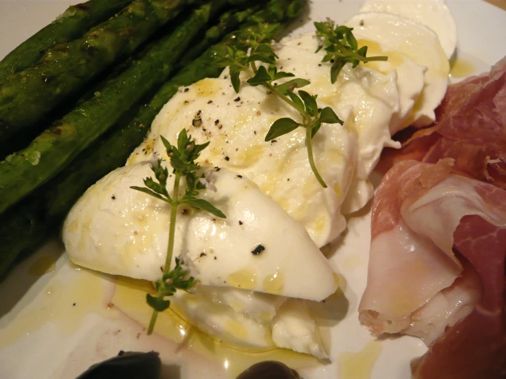 asparagus and eggs on white plate with ham