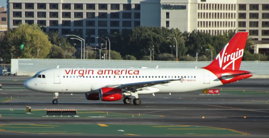 an american virgin airlines jet taking off from an airport