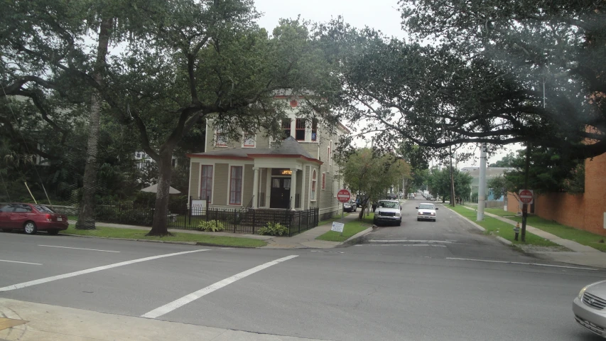 a street scene with cars and trees on it