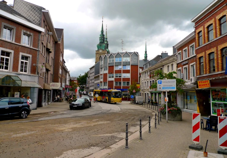 a road that is lined with buildings and traffic signs