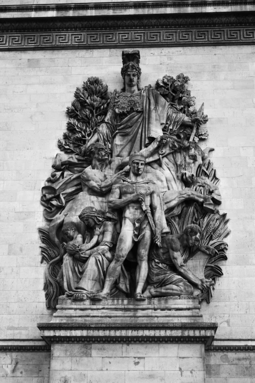 an ornate statue on the side of a building