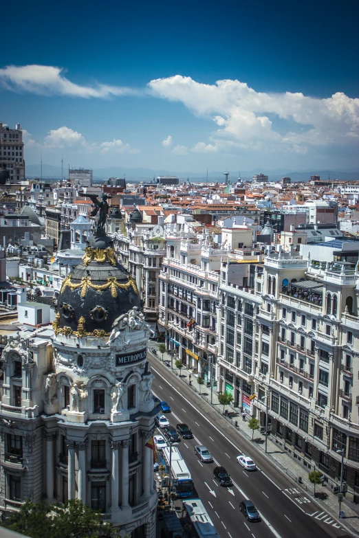 a city with buildings and buses on a street