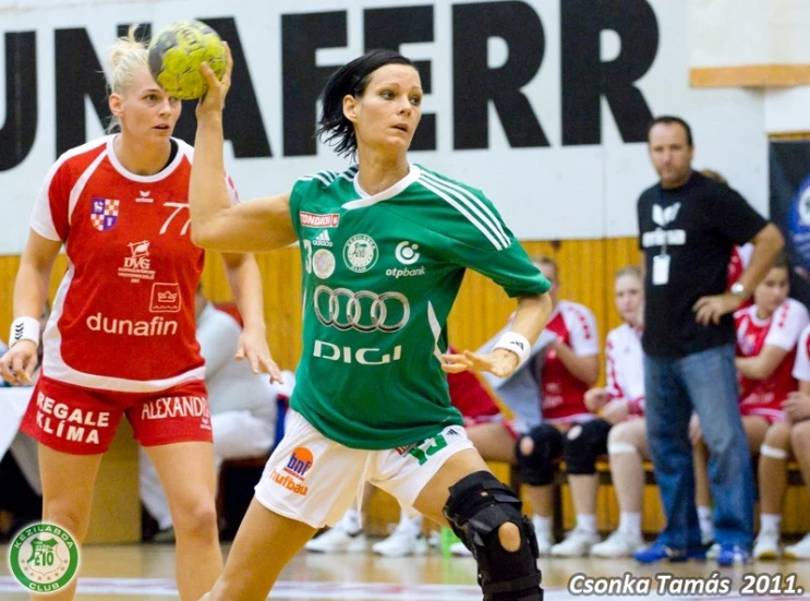 two women with ball on court during a game