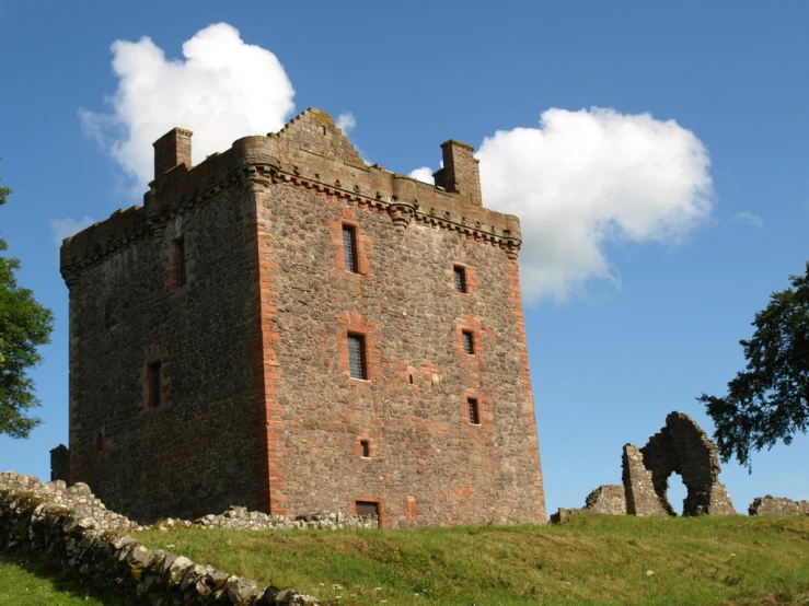 an old brick castle with the sky as background