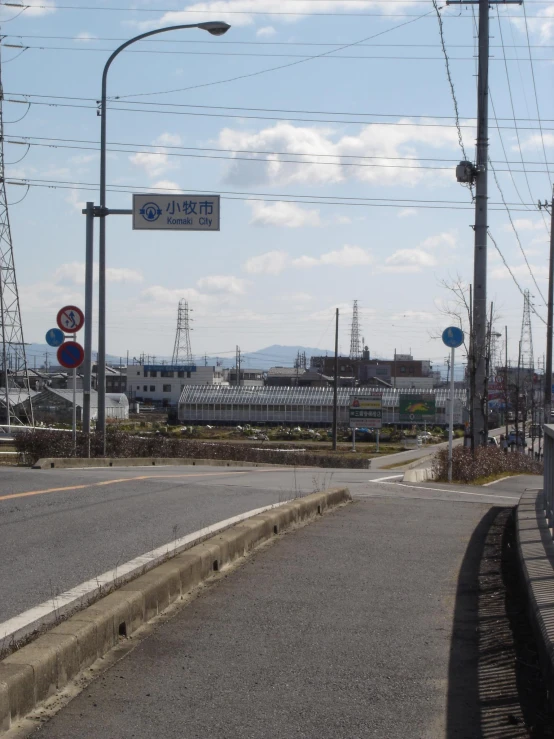 an empty street is viewed from the other side of the street