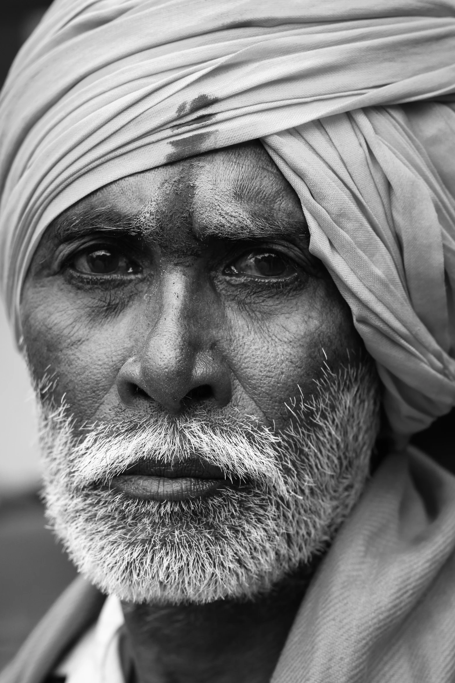 a man in turban poses for a po