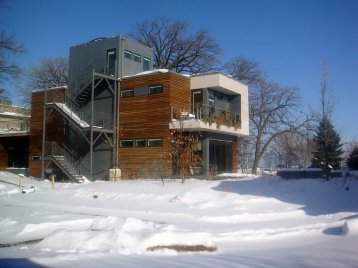 a building is shown in the snow on a sunny day