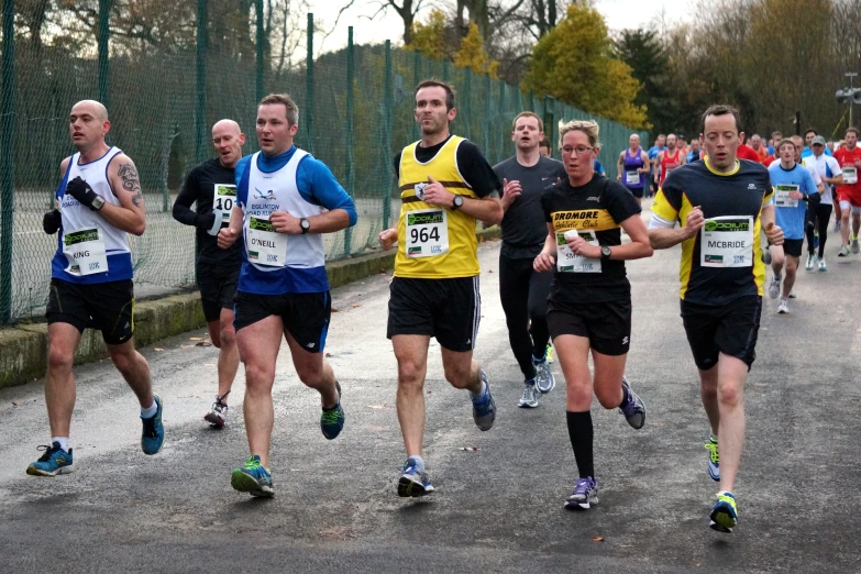 a group of men running down a road