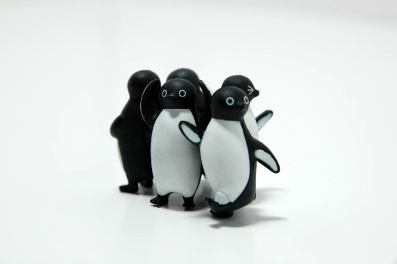 there is a small penguin with smaller ones