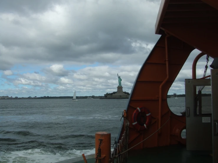 the ship has a bridge leading to statue of liberty