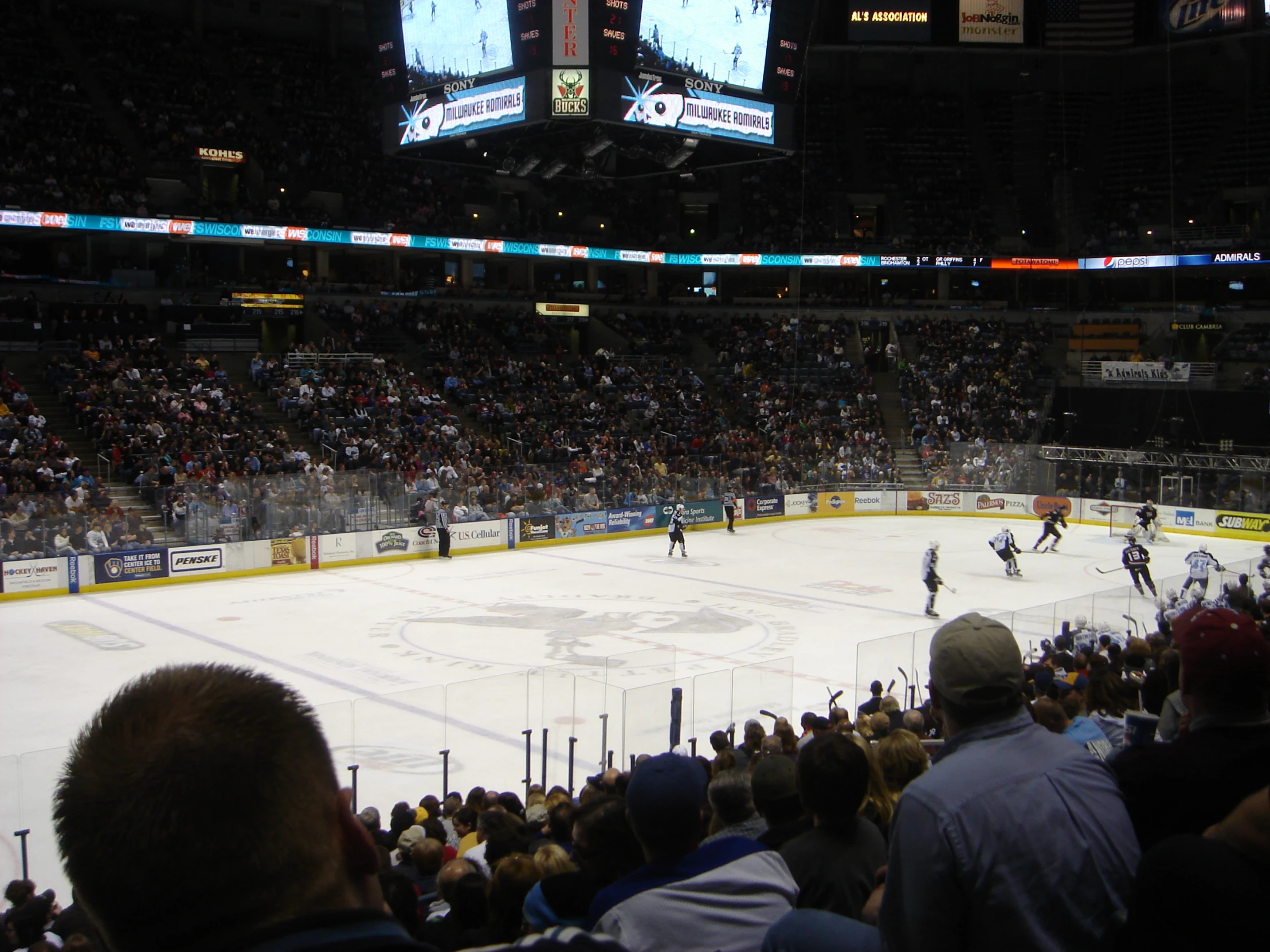 several ice hockey players on the skating rink