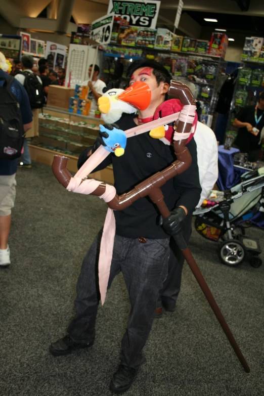 a man with a huge head and two handles carrying an oversized balloon